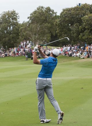 Jordan Spieth plays his approach shot at the Australian Open of Golf 2014, Sydney